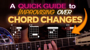 playing the chord changes on guitar